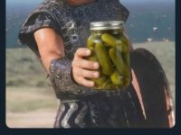 Eric Bana as Achilles from Troy holding a jar of pickles
